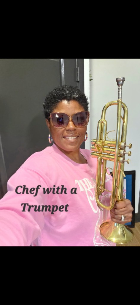 Chef Towanda playing trumpet